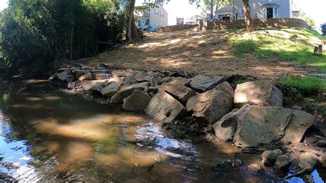 Civil engineers, best way to shore up an eroded creek bank